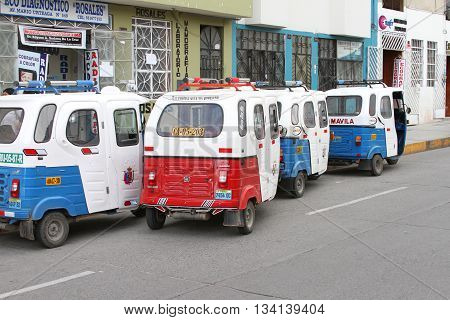 Cajamarca Peru - June 11 2016: Four parked moto-taxis on the street in Cajamarca Peru on June 11 2016