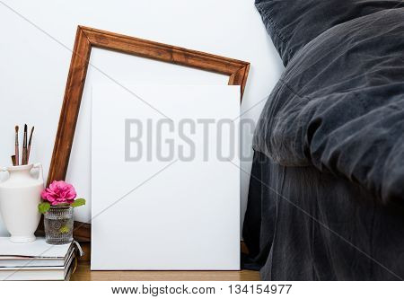 Empty blank white canvas on a floor, home bedroom interior decor, painting art poster mock-up