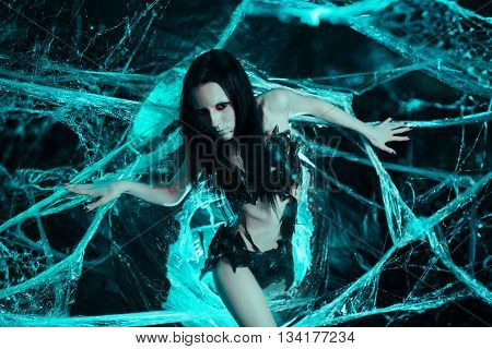 Girl like a spider getting out from the cocoon