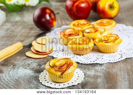 Sweet apple rose cake. Sweet gourmet cupcakes. Homemade sweet apple dessert. Homemade apple rose pastry.