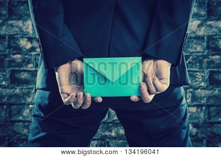 Has A Letter Man Wearing A Suit