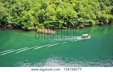 Motor boat in the lake of Canyon Matka in Macedonia