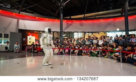 TOKYO JAPAN - NOVEMBER 27 2015: Asimo the humanoid robot created by Honda is presented at Miraikan The National Museum of Emerging Science and Innovation in Odaiba area