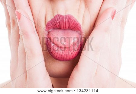 Close-up With Hands On Face And Tongue Out