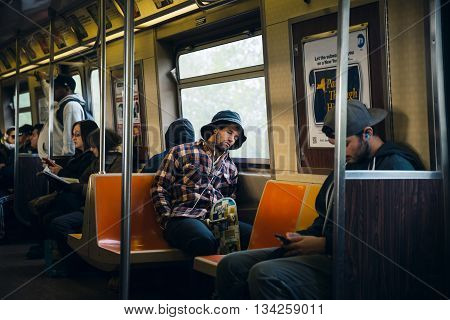 Commuters In New York Subway Wagon