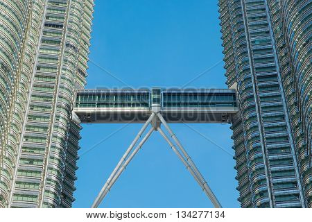 KUALA LUMPUR MALAYSIA - FEBRUARY 29: Close up view of skybridge of Petronas Twin Towers on February 29 2016 in Kuala Lumpur Malaysia. A skybridge connects the two towers.
