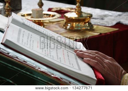 Voyutyn Ukraine - January 08 - Priest Reading From The Holy Bible In Voyutyn On January 08 2009. Sha