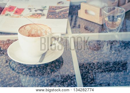 Empty coffee cup in white coffee cup on table , soft focus warm tone