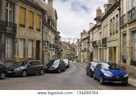 AUTUN FRANCE -SEPTEMBER 12 2010: An ancient lane in the old town of Autun. Autun is a commune in Burgundy in eastern France. It was founded during the early Roman Empire as Augustodunum.