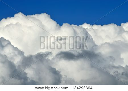 White Cumulus clouds against blue sky closeup