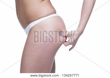 Cellulite on buttocks and thighs. Young caucasian woman body. Isolated on white background