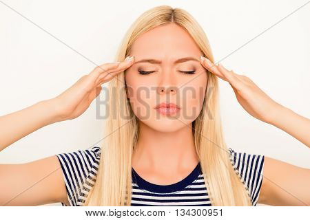 Portrait Of Overworked Tired Unhappy Girl With Migraine