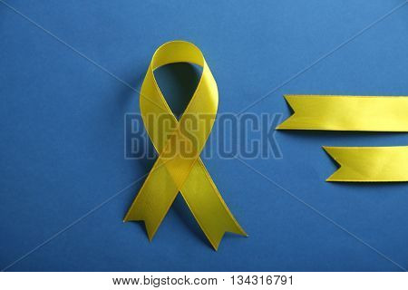 Yellow ribbon on blue background