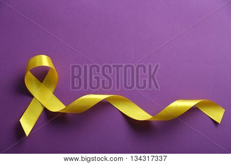 Yellow ribbon on purple background
