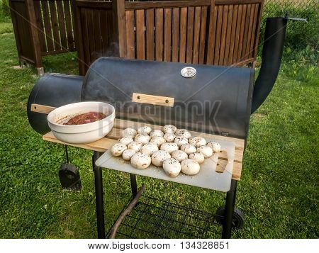Red meat chops and champignons ready for being placed on barbecue
