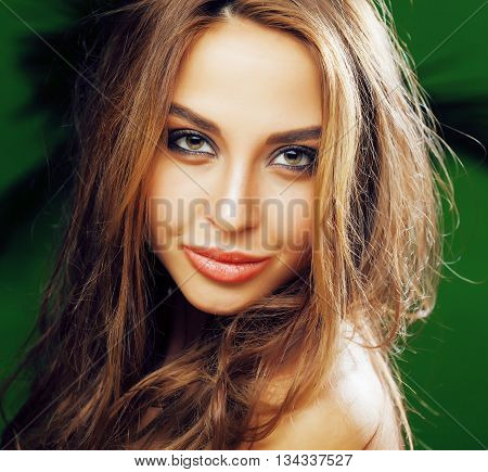 young cute blonde woman on green palm background smiling happy, lifestyle peole concept close up, beauty makeup
