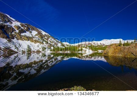 Grand Teton National Park, Wyoming. Reflection of mountains on Jackson Lake near Yellowstone.