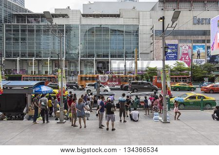 BANGKOK THAILAND - MAY 22 : people at bus stop in front of Big C Supercenter in Ratchaprasong area on may 22 2016 thailand. Ratchaprasong is one of is famous landmark of Bangkok