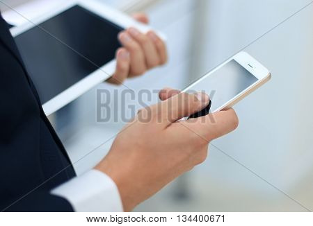 businessman working with modern devices digital tablet computer and mobile phone
