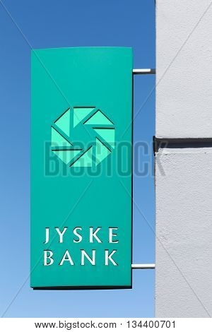 Aarhus, Denmark - June 11, 2016: Jyske Bank sign on a panel. Jyske bank is the third largest Danish bank in terms of market share.