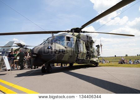 BERLIN / GERMANY - JUNE 3 2016: tactical troop helicopter NH90 from nato helicopter industries stands in berlin germany on june 3 2016.