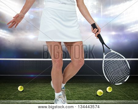 Athlete playing tennis with a racket against american football arena