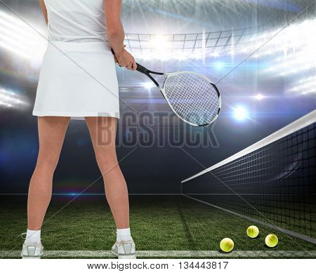 Athlete playing tennis with a racket against american football arena