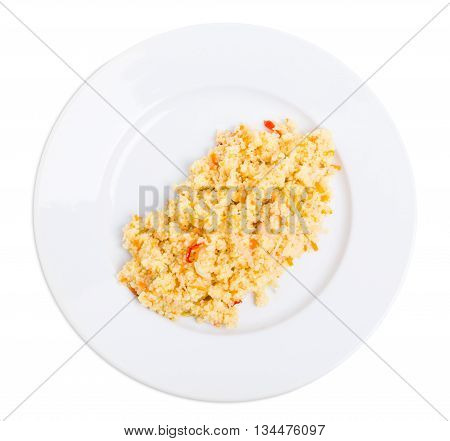 Delicious couscous porridge with tomatoes and onions. Isolated on a white background.