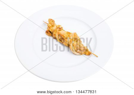 Grilled chicken fillet shish kebab on skewer. Isolated on a white background.