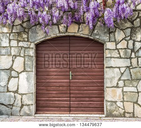The door, decorated with wisteria on the street the city of Herceg Novi, Montenegro