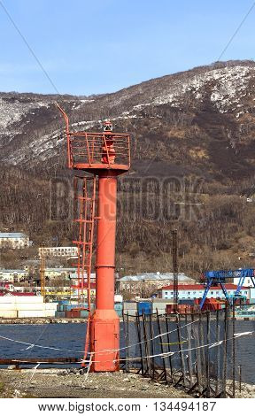 Lighthouse on the seafront in avacha Bay on the Kamchatka peninsula