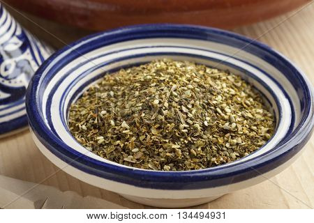  Bowl with Moroccan mixture of different dried herbs called zatar