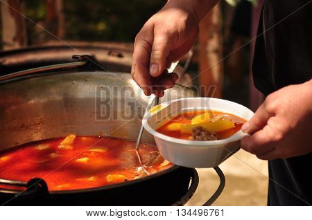 One ration Traditional Goulash soup in the garden