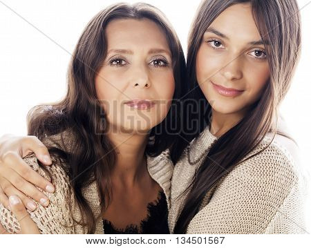 cute pretty teen daughter with real mature mother hugging, fashion style brunette makeup close up tann s, warm colors isolated on white background