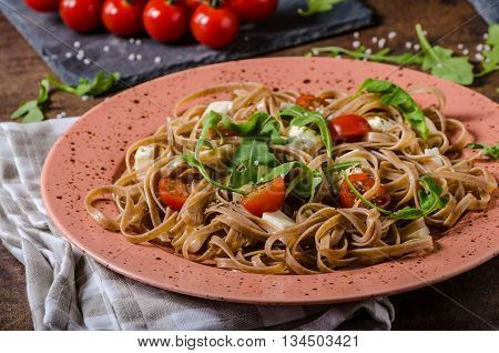 Spaghetti With Mozzarella, Cherry Tomatoes And Arugula