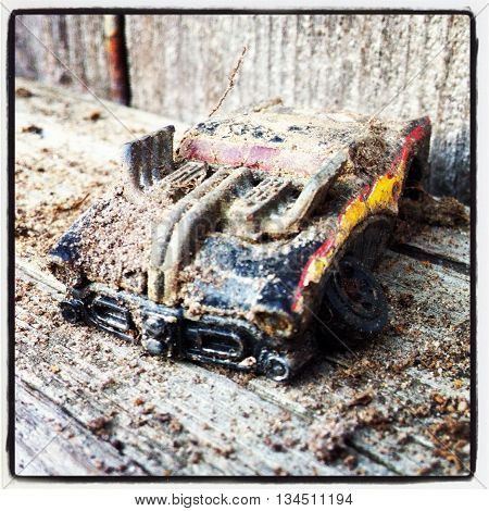 old broken toy on a dirty bench.