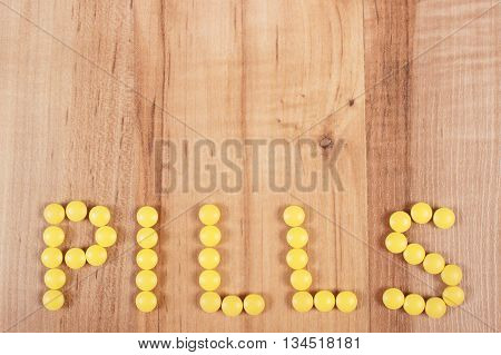 Inscription Pills Made Of Yellow Medical Tablets, Health Care Concept, Copy Space For Text