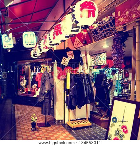 Tokyo - May 2016: Glowing store display at night in Koenji. 