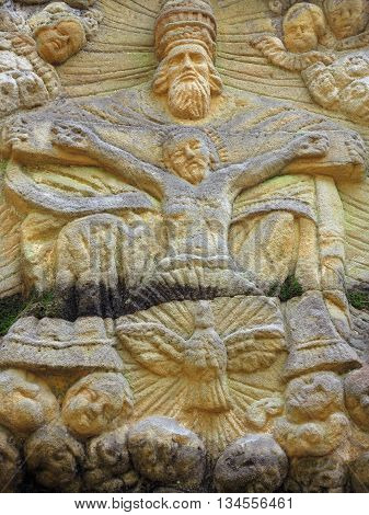 Relief of the Holy Trinity - stone altar carved in sandstone cliff in the forest from 1740