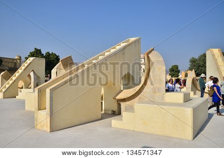 Jaipur India - December 29 2014: People visit Jantar Mantar observatory on December 29 2014 in Jaipur India. The collection of architectural astronomical instruments were built by Sawai Jai Singh II in 1727-1734.