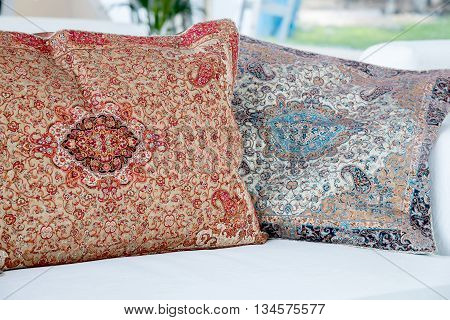 the two pillows with a Arabic pattern