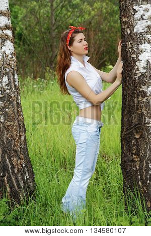 Girl resting in the foliar forest summer