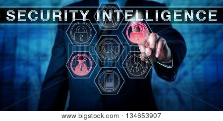 Corporate manager touching SECURITY INTELLIGENCE on a virtual interactive control display. Business metaphor and cyber security concept for counter measures and expertise to protect valuable assets.
