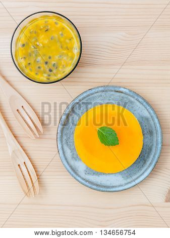 Passion Fruit Cheesecake With Fresh Mint Leaves On Wooden Background. Passion Fruit Cheesecake Setup