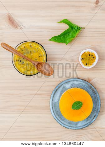 Passion Fruit Cheesecake With Fresh Mint Leaves On Wooden Background. Passion Fruit Cheesecake Setup