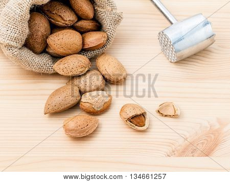 Almonds Kernels And Whole Almonds On Wooden Background. Whole And Chopped Almond On Wooden Backgroun