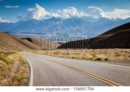 Road in California with mountains on the horizon