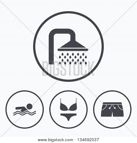 Swimming pool icons. Shower water drops and swimwear symbols. Human swims in sea waves sign. Trunks and women underwear. Icons in circles.