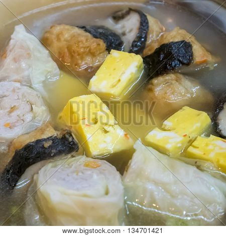 The close up of Taiwanese oden meat balls in soup at food street night market in Taipei, Taiwan.