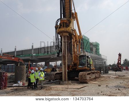 MALACCA, MALAYSIA - MARCH 12, 2015: Bore pile rig machine at the construction site in Malacca, Malaysia. The machine used to driven pile for building foundation work.